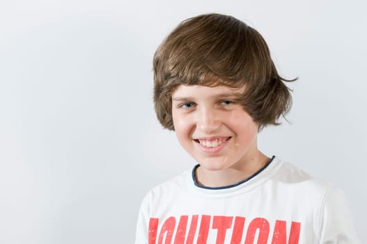 Head-and-shoulders portrait of a male teenager against a white background