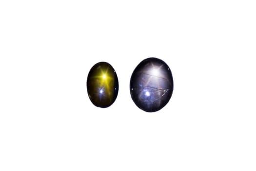 Two sapphires with star-shaped light reflection,cropped