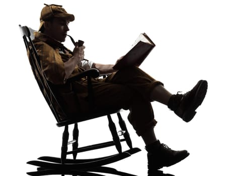 sherlock holmes reading silhouette sitting in rocking chair in studio on white background