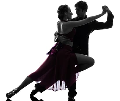one caucasian couple man woman ballroom dancers tangoing  in silhouette studio isolated on white background