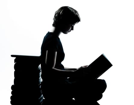 one caucasian young teenager silhouette girl reading full length in studio cut out isolated on white background