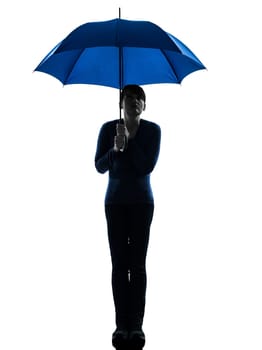 one caucasian woman holding umbrella  pouting in silhouette studio isolated on white background