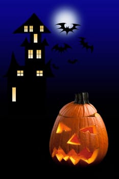 Haunted castle with Halloween pumpkin