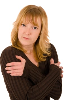 Upper body portrait of a young blonde woman in a brown sweater against a white background