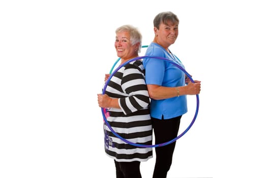 Two seniors with Hula Hoop - exposed on white background
