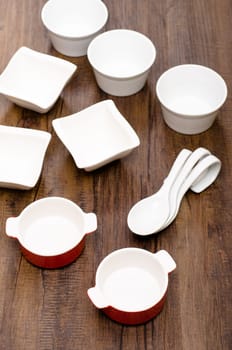 Different porcelain bowls on a wooden table