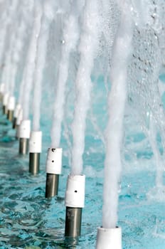 series of fountains in a swimming pool