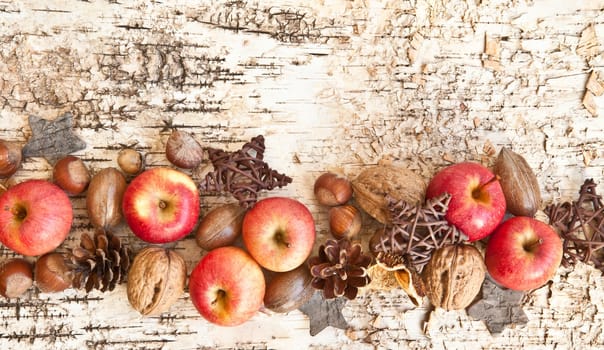 Rustic background with small apples and noodles