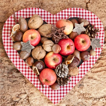 Rustic background with small apples and noodles