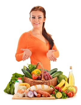 Young woman with assorted grocery products isolated on white background