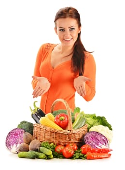 Young woman with assorted vegetables isolated on white background