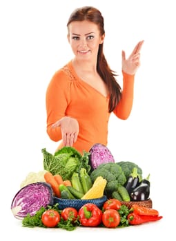 Young woman with assorted vegetables isolated on white background
