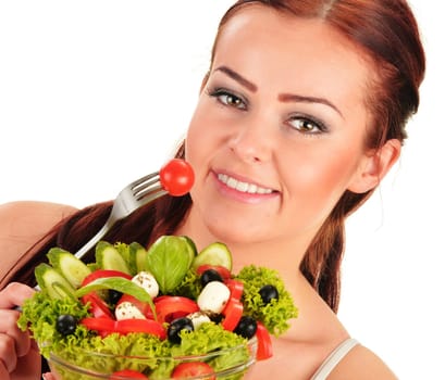 Young woman eating vegetable salad