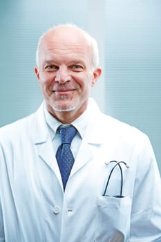 Self confident smiling doctor in white coat