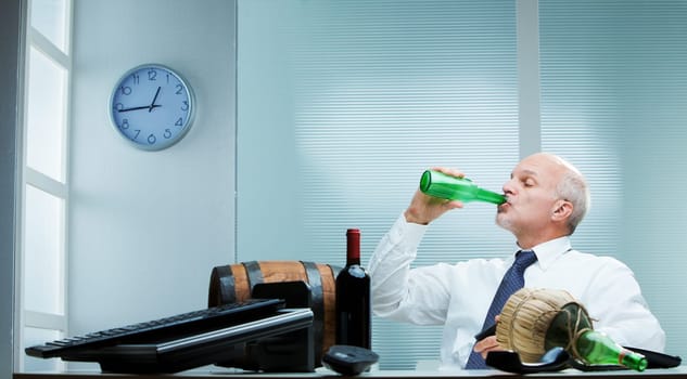 Businessman drinking every kind of alcoholic