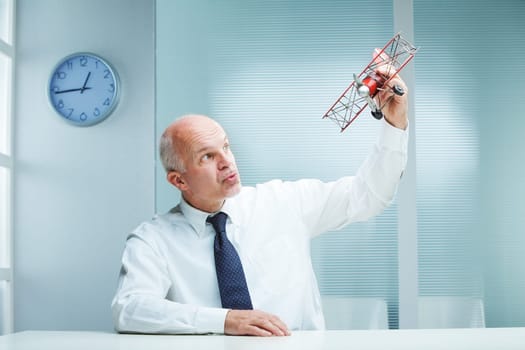 Business Flying Toy Airplane in his office