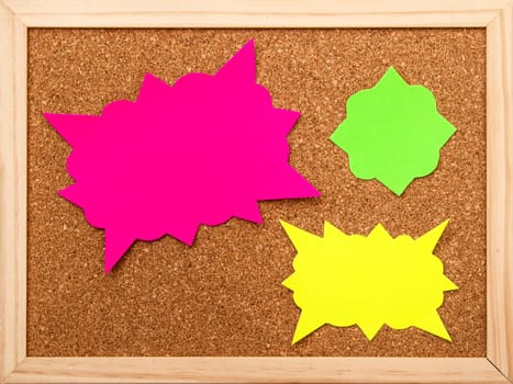 Cartoon bubbles on a cork board background.
