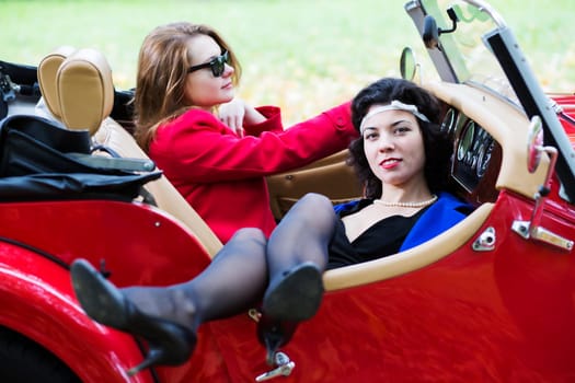 Young women take vocation ride on red car