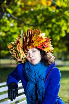 Young woman relay at park bench under tree