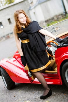 Satisfied woman in black come out from car