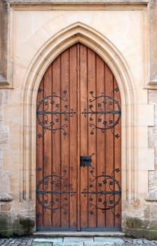 Gothic door at medieval castle in Europe.