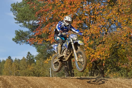 ZABREH, CZECH REPUBLIC - OCT 19.Motocross rider is jumping at Motocross Zabreh Cup on October 19, 2013 in Zabreh, Czech Republic (Central Europe)