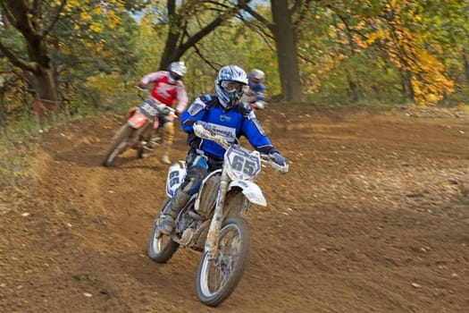 ZABREH, CZECH REPUBLIC - OCT 19. Group of motocross riders in turn at Motocross Zabreh Cup on October 19, 2013 in Zabreh, Czech Republic (Central Europe)