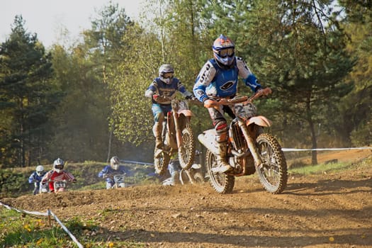 ZABREH, CZECH REPUBLIC - OCT 19.Motocross riders after start at Motocross Zabreh Cup on October 19, 2013 in Zabreh, Czech Republic (Central Europe)
