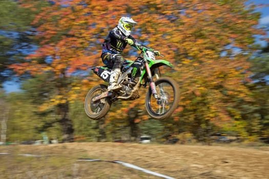 ZABREH, CZECH REPUBLIC - OCT 19. Dynamic shot of motocross ride, which is jumping at Motocross Zabreh Cup on October 19, 2013 in Zabreh, Czech Republic (Central Europe)