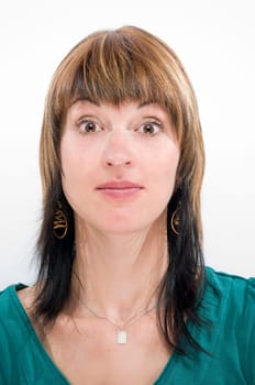 Head-and-shoulder shot of a young woman looking into the camera and a gesture of incomprehension