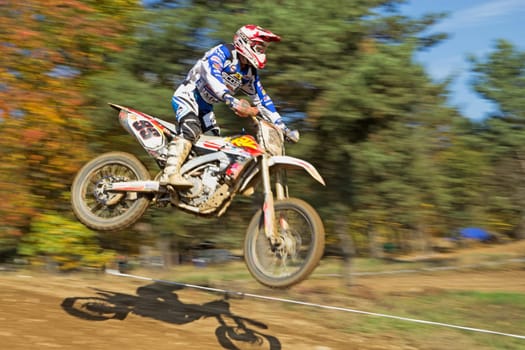 ZABREH, CZECH REPUBLIC - OCT 19.Dynamic shot of motocross rider, which  is jumping at Motocross Zabreh Cup on October 19, 2013 in Zabreh, Czech Republic (Central Europe)