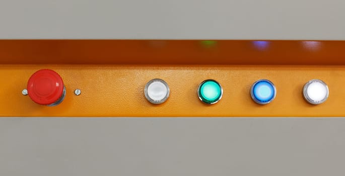 Panel of buttons on loom at textile factory, close-up