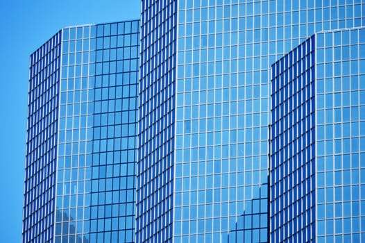 Modern commercial architecture over blue sky