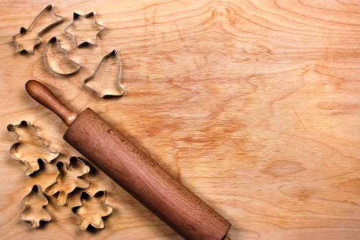 Baking board with cookie cutters and rolling pin