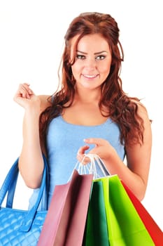 Young woman with shopping bags isolated on white background
