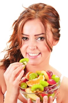 Young woman eating fruit salad
