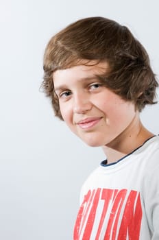 Head-and-shoulders portrait of a male teenager against a white background