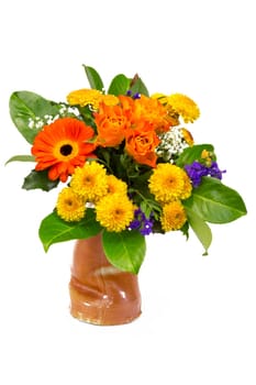 A bouquet of roses,statice,veil herb,chrysanthemums and marigolds in a vase