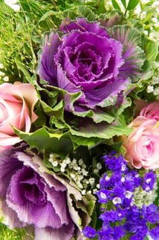 A bouquet of roses,statice and veil herb,close-up top view