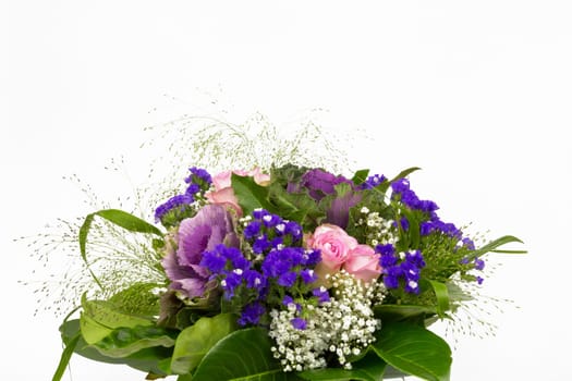 A bouquet of roses,statice and veil herb