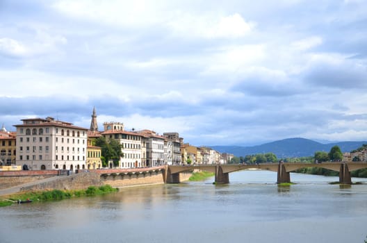 Picturesque view on Bridge alle Grazie over Arno River in Florence, Italy