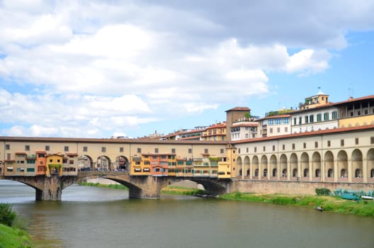 Picturesque view on colorful Ponte Vecchio over Arno River in Florence, Italy