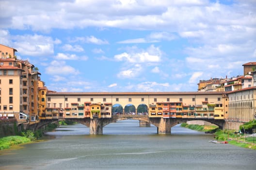 Picturesque view on colorful Ponte Vecchio over Arno River in Florence, Italy