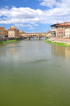 Picturesque view on colorful Ponte Vecchio over Arno River in Florence, Italy
