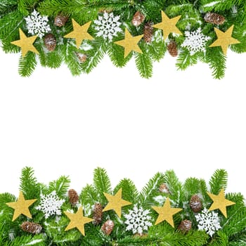 Studio shot of fresh fir branches on white,decorated with stars,cones and snow