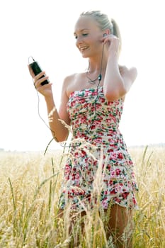 Young attractive woman listening to music