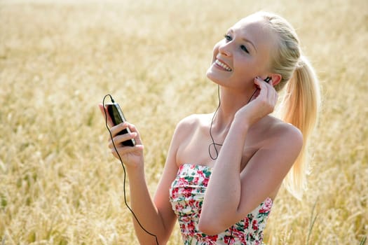 Young attractive woman listening to music