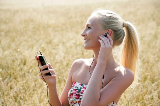 Young attractive woman listening to music