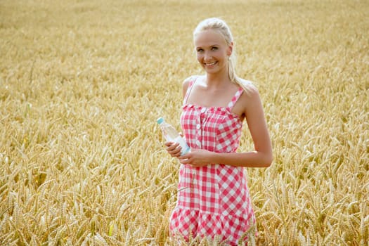 Young woman with water bottle