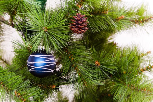 christmas decorations hanging on christmas tree